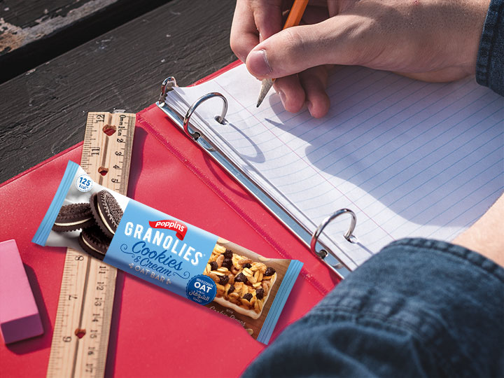 Student studying with a Granlolies Bar to boost his energy
